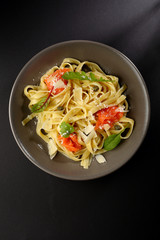 Homemade pasta in bowl top view