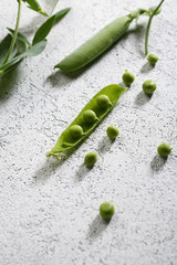 White background with fresh green peas