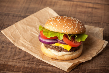Fresh burger on wooden table