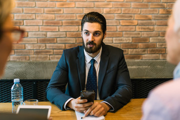 Business meeting. Handsome young man conducting a job interview.