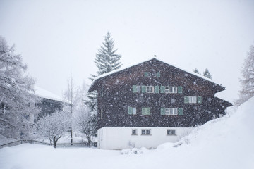 mountain house in snowstorm