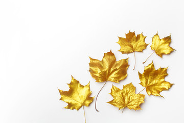 Autumn composition. Frame made of autumn golden leaves on light grey background. Flat lay, top view, copy space