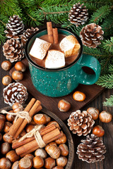 Fototapeta na wymiar Still life with mugs of hot chocolate on wooden background