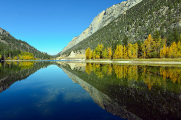 Fototapeta premium Mountains reflected in Crown Lake in Marble Canyon Provincial Park, British Columbia, Canada