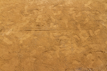 Sand background in construction site and Children footprints.