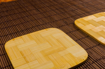 bamboo Mat - stand food with bamboo stands for hot, close-up, wooden background
