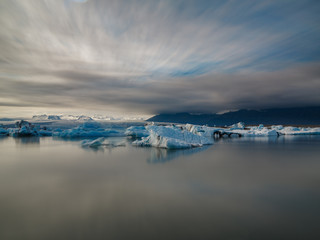 Fototapeta na wymiar blue icebergs in lagoon, ultra long exposure