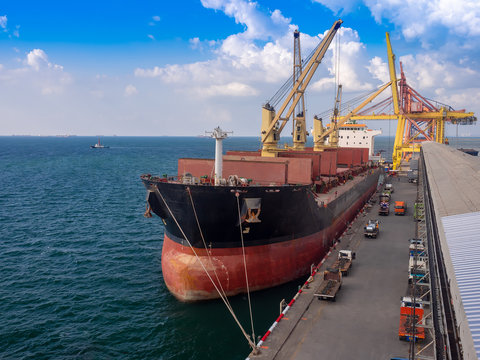Vessel alongside at thailand port and discharging general cargo. Vessel operation's concept.