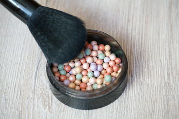 Multicoloured corrector face powder balls for make up. Powder Brush.