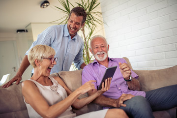 Obraz premium Family using tablet at home