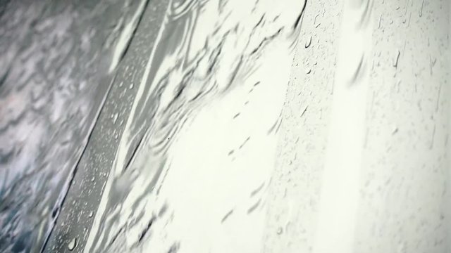 HD 1080p super slow rain drops on glass texture and backgound	