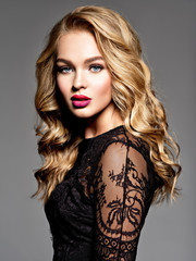 Blond woman with long curly beautiful hair.