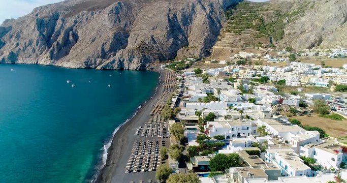 village and beach on the island of Santorini in aerial view