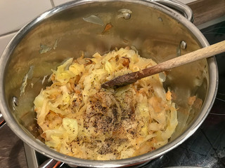 Sliced cabbage in a pot in kitchen 