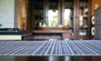 blurred rustic kitchen interior - focus on napkin and desk space