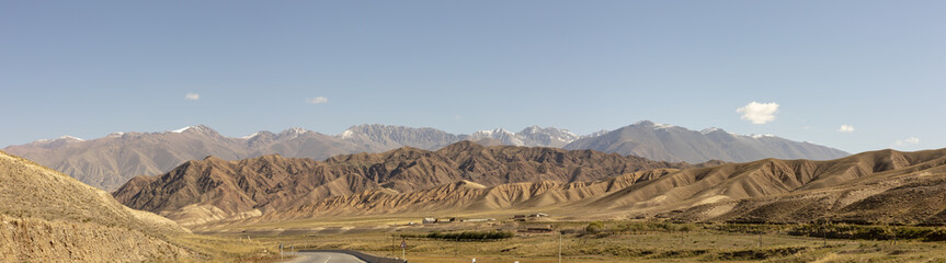 Panorama of road through Chu River Valley gorge in rural Kyrgyzstan