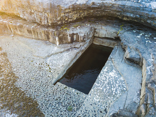 Aerial view of the famous "Wormhole" (Poll na bPeist in gaelic) in Inishmore, Aran Islands, Ireland