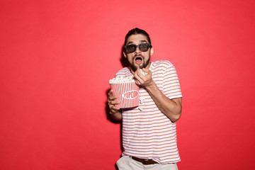Portrait of scared man in 3d eyeglasses watching movie