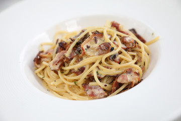 Spaghetti carbonara , Spaghetti white sauce with cheese bacon in outdoor restaurant italian food