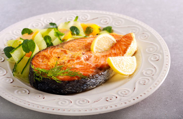 Cooked salmon steak and salad