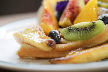 Dessert baked Waffle with fruits kiwo grape berry and vanilla ice cream vintage style