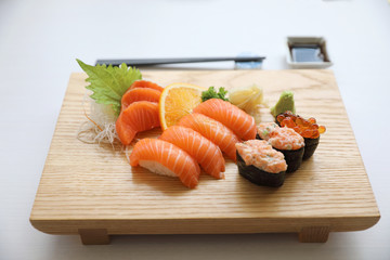 Salmon sushi and sashimi on wood plate Japanese food