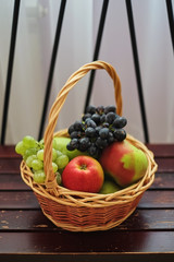 Baskets with apples, and grapes. Baskets with fruit.