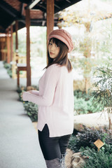 Portrait japanese fasion style wool coat fashion dress in japanese garden