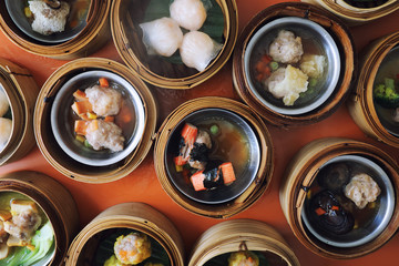 Dim sum on wood basket , Chinese food top view