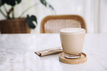 cappuccino or Latte art coffee made from milk on the wood table in coffee shop