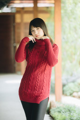 Portrait japanese fasion style wool coat fashion dress in japanese garden