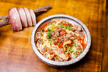 A bowl of chicken noodles