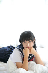 Portrait japanese school girl in white tone bed room