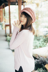 Fototapeta premium Portrait japanese fasion style wool coat fashion dress in japanese garden