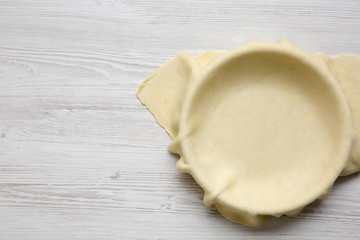 Raw dough for preparation apple pie, overhead view. Copy space.