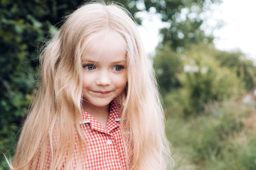 Fototapeta premium Hair is important part of her look. Small girl with blond hair. Happy little child with adorable smile. Small child happy smiling. Little girl wear long hair. Be happy
