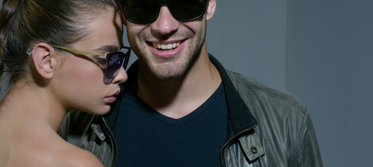 Friendly relations. Fashion models in trendy sun glasses. Couple in love. Couple of man and woman wear fashion glasses. Love relations. Friendship day. Friendship relations. Accessorize your eyesight © Volodymyr