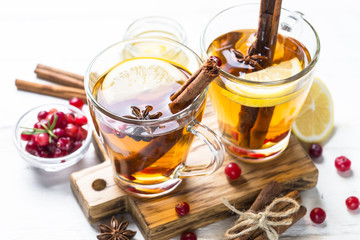 Autumn or winter hot tea with fruit, berries and spices.