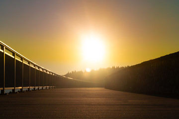 sunset over a bridge