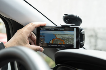 Navigator on the windshield of the car. Concept: travel on the Navigator.