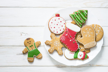 Christmas gingerbread in the plate on white top view.