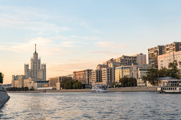 Fototapeta premium Moscow river evening panorama with a city skyline and Stalin's skyscraper in the background