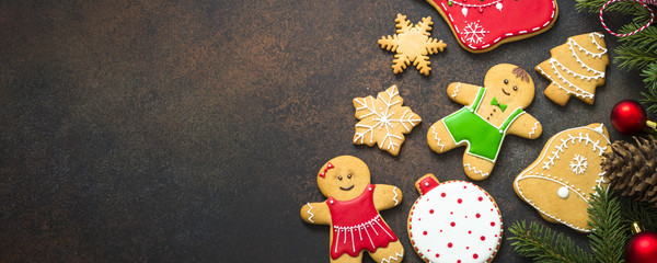 Christmas gingerbread with christmas decorations on dark  backgr