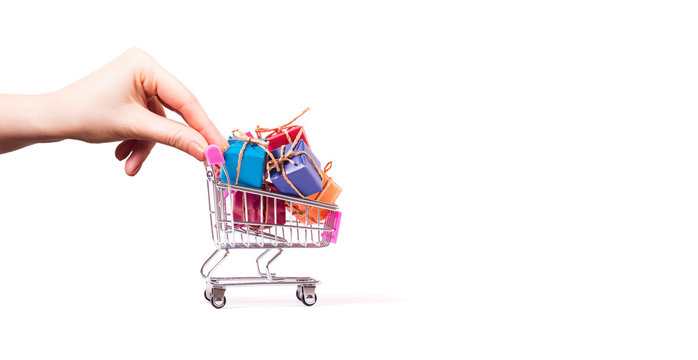 hand push shopping basket filled with gift box