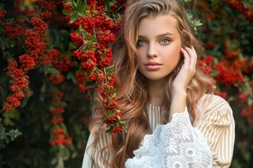 Beautiful girl walking outdoors in autumn.
