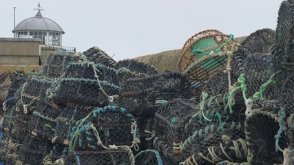 A stack of lobster fishing pots in St Ives harbour, Cornwall.