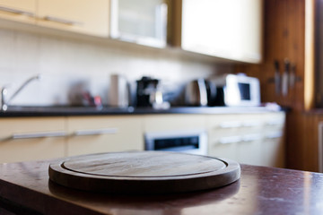 blurred rustic kitchen interior - focus on cutting board