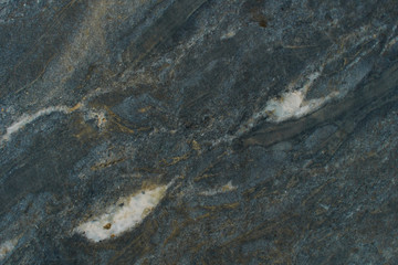 The natural dark marble texture wich shapes within