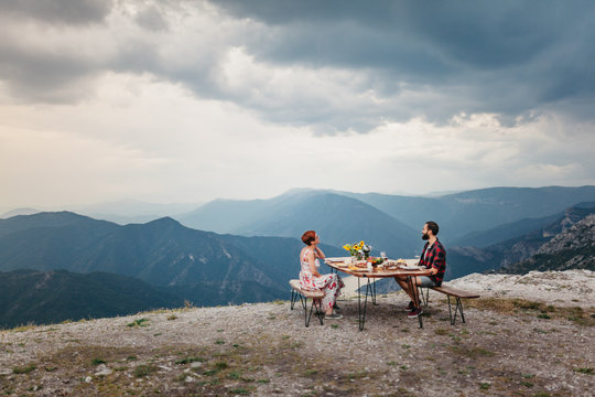 Romantic Dinner Of Young Couple On Mountain Top