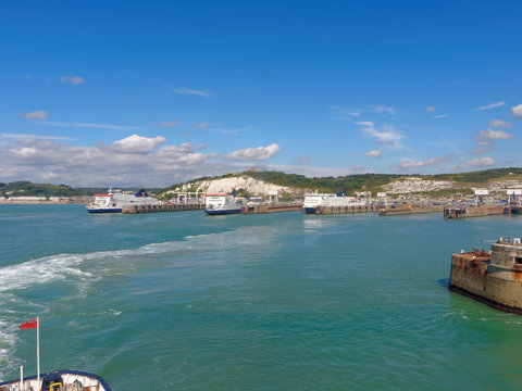 Three ferries at the port of Dover on a sunny day.